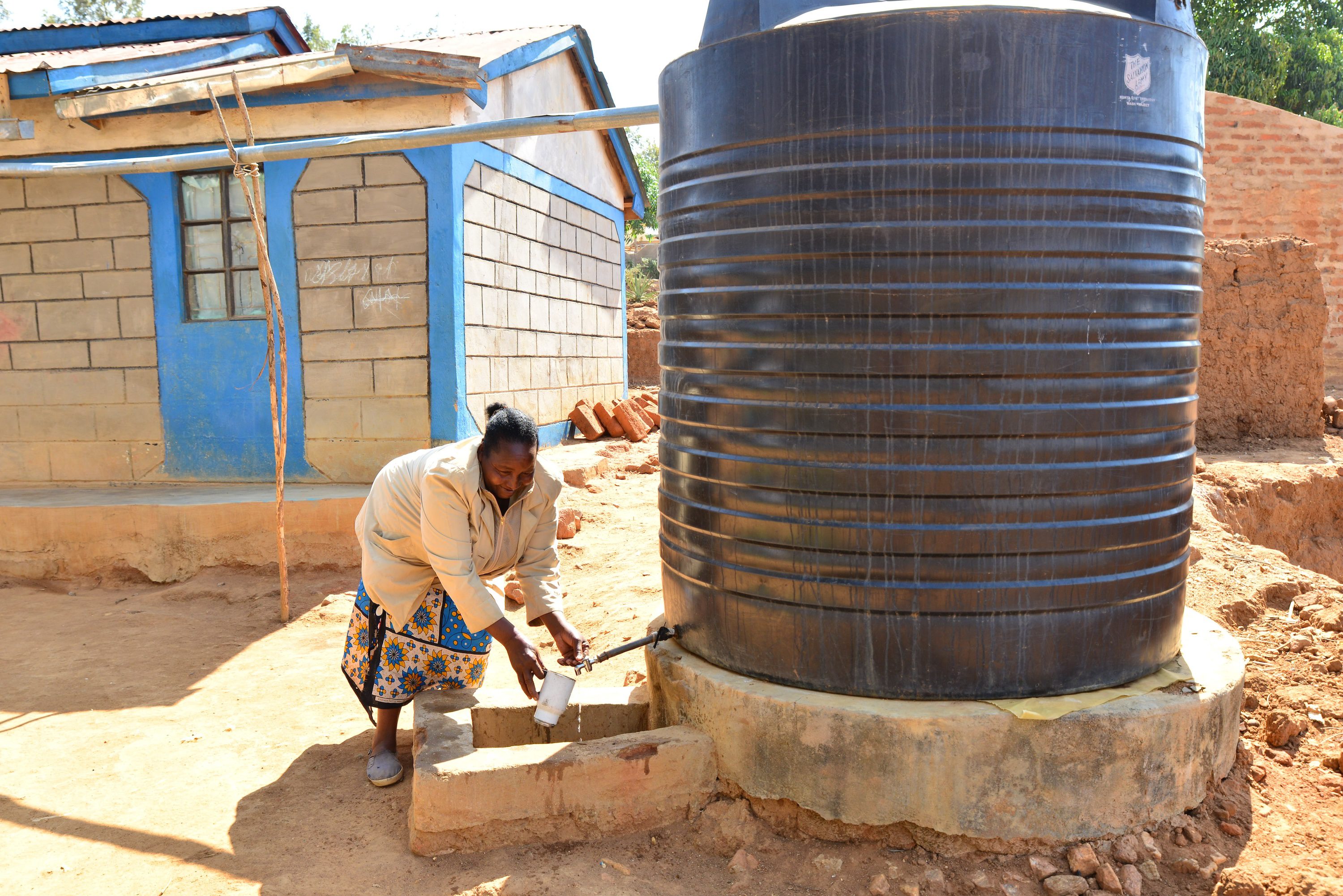 Tabitha fetching water from tank